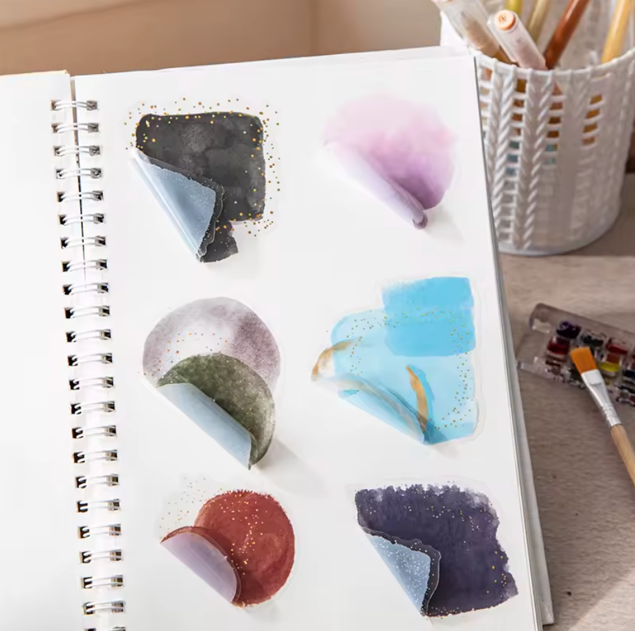 6 paquetes de 10 Stickers manchas acuarela & brillos dorados